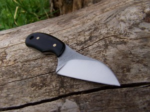 A very small utility or box cutter knife
